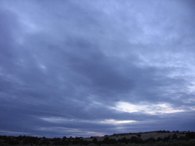 huge sky in front of sunset 