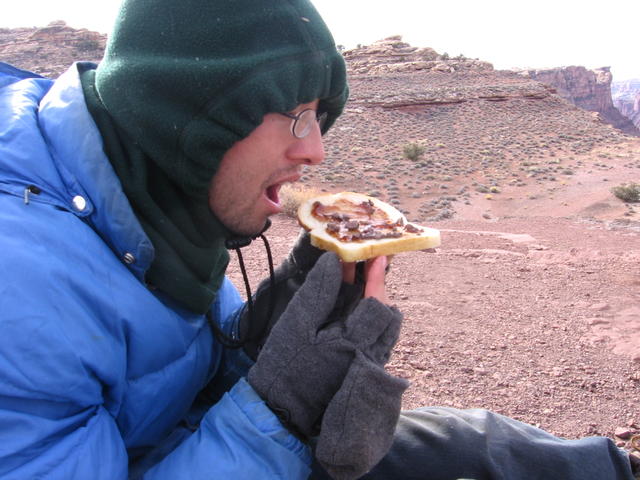 John discovers the "bread falls butter-side down" pricniple, attempts to eat the ensuing rock sandwich
